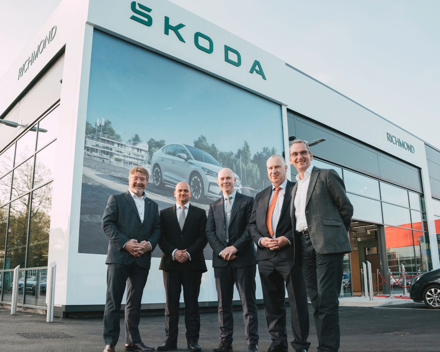 richmond motor group management team outside new Richmond Skoda Portsmouth showroom, left to write Kevin Rendell Head Of Network Sales, Wayne Sims Dealer Principal, Sam Nobes Operations Director, Michael Nobes Managing Director, Matthew Bowden Director Of Skoda