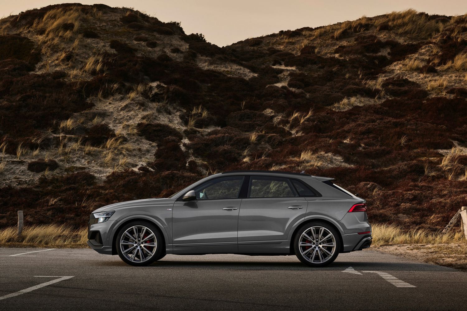 New Audi Q8 in grey, side view image of vehicle parked