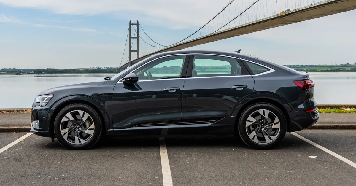 Audi Q8 e-tron parked on side angle in front of Humber Bridge in Hull