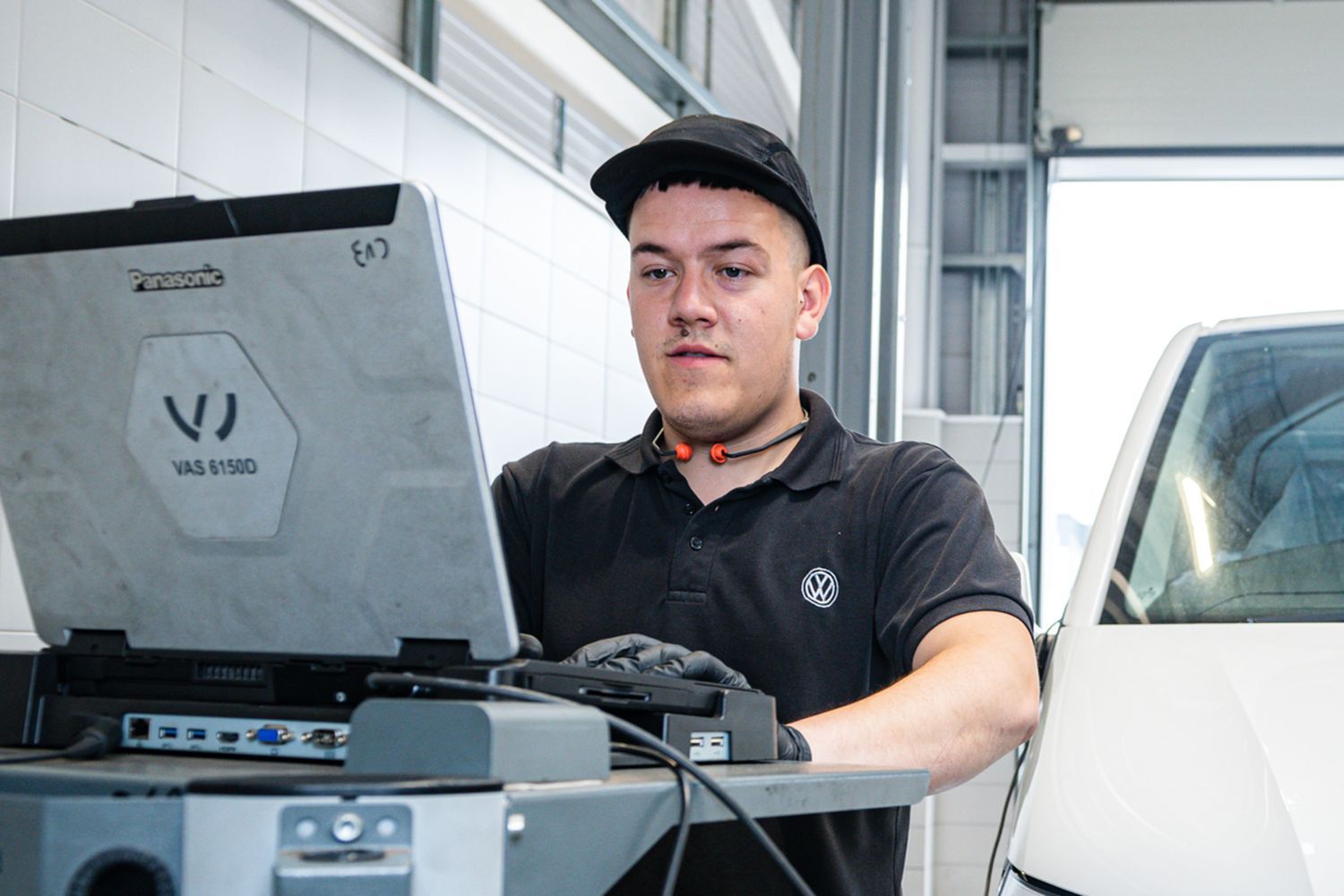 Volkswagen Commercial Vehicle Technician carrying out MOT preparation.