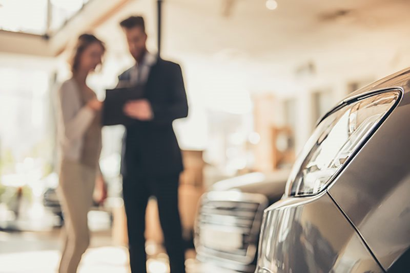 customer and car dealer
