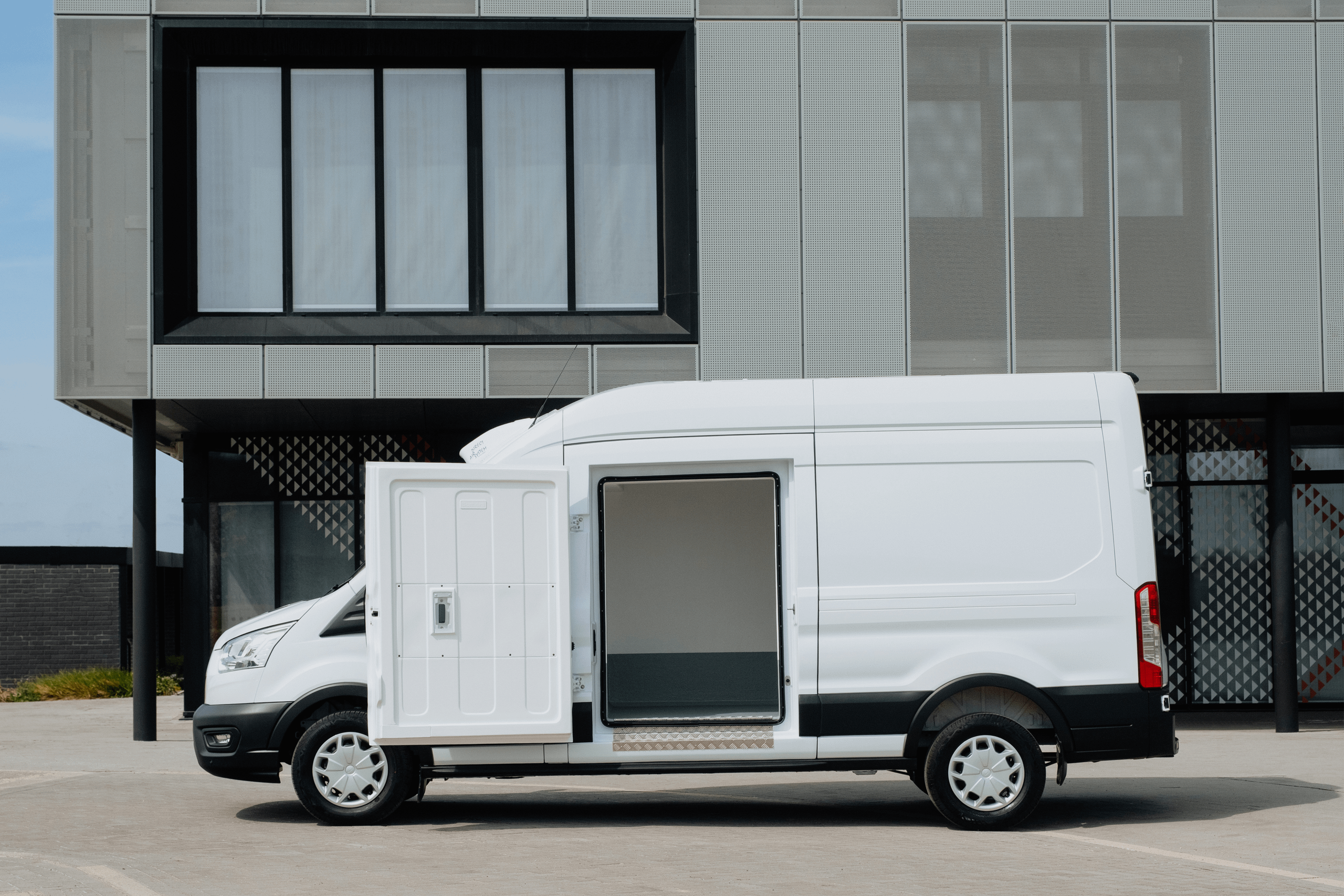 Side view of Ford Transit One Stop Shop with side door open