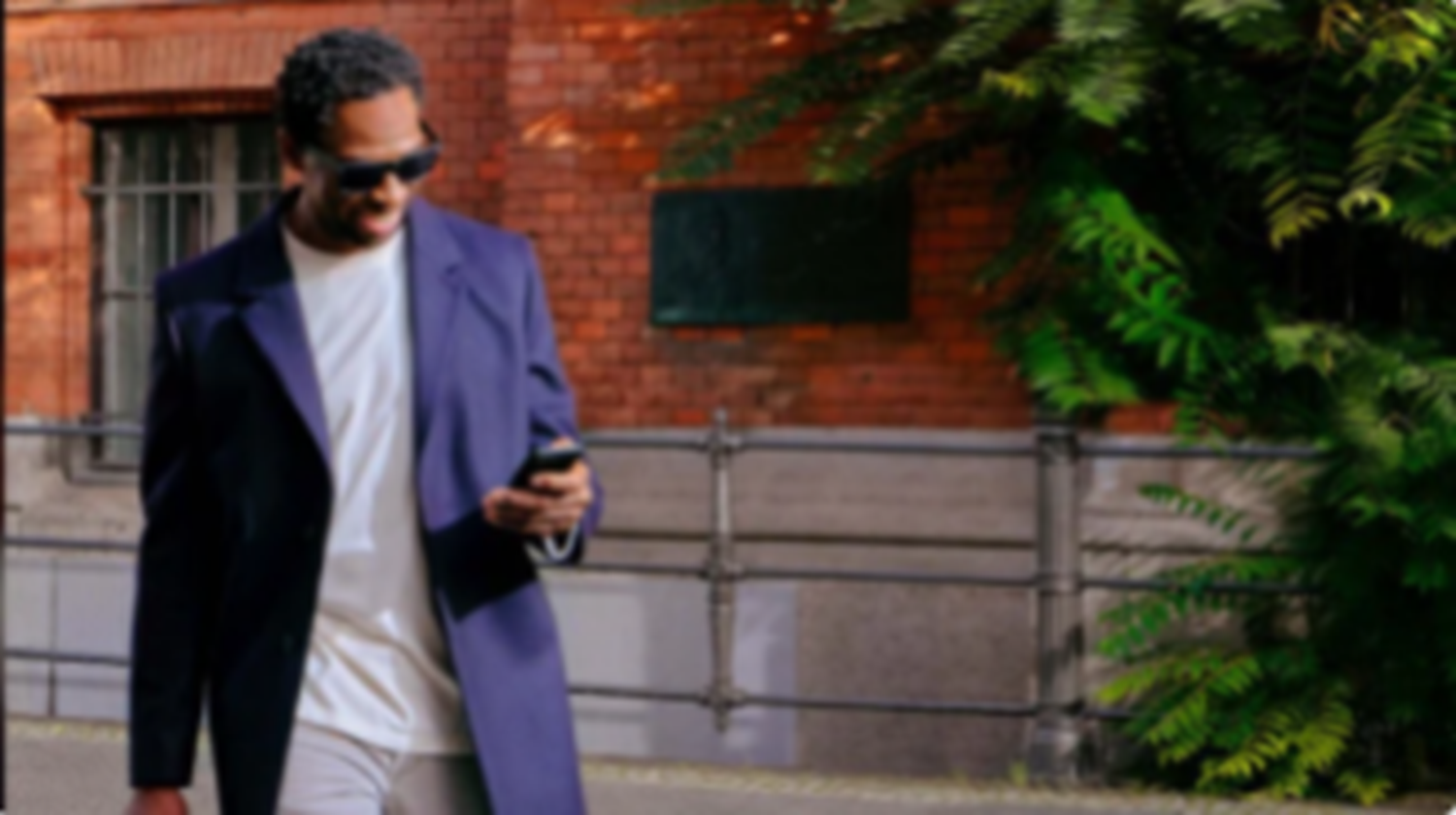 Man looking at phone whilst walking