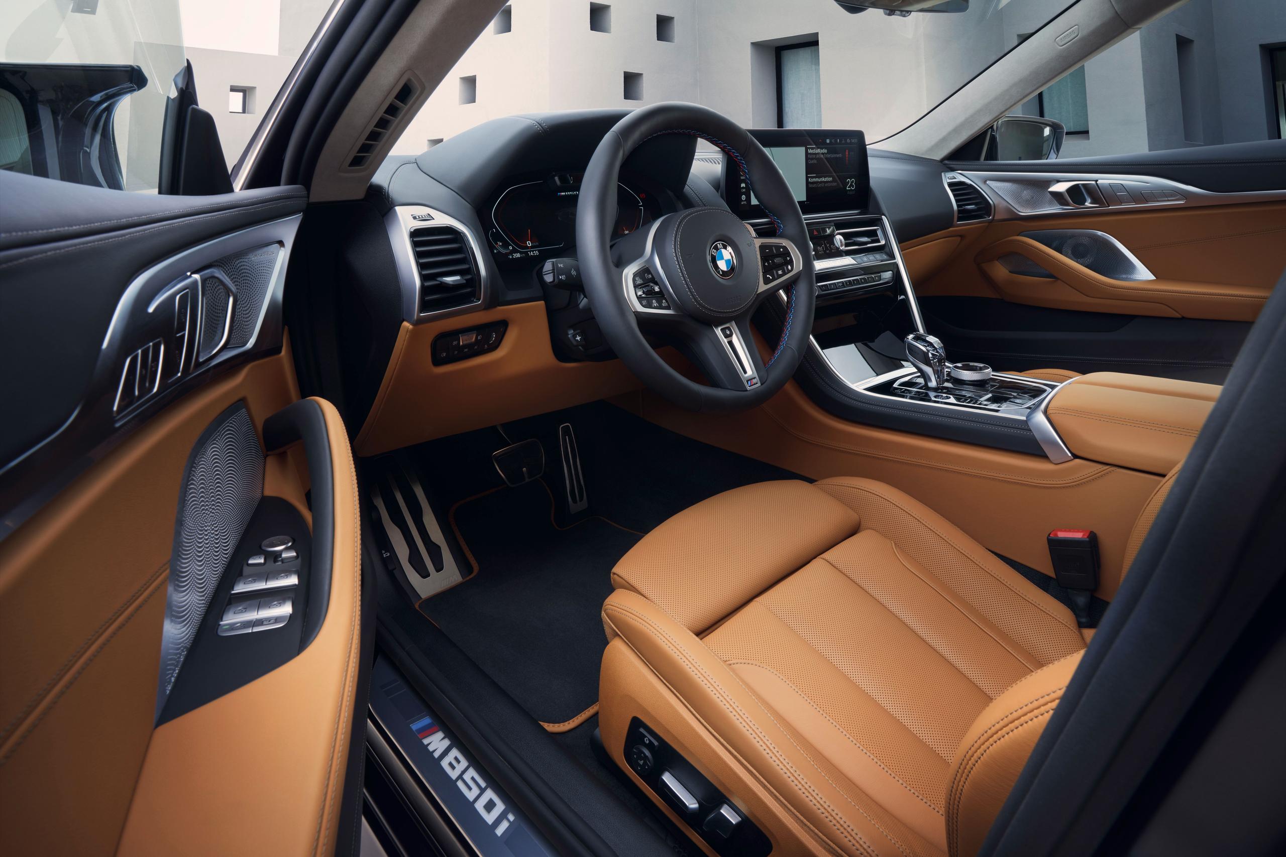 New BMW 8 Series Gran Coupe image of drivers side steering controls and leather seating
