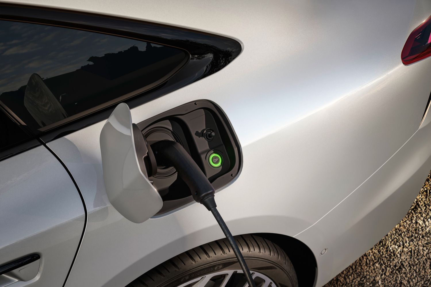 Close-up of the Audi A6 Hybrid whilst plugged into an electric charging point