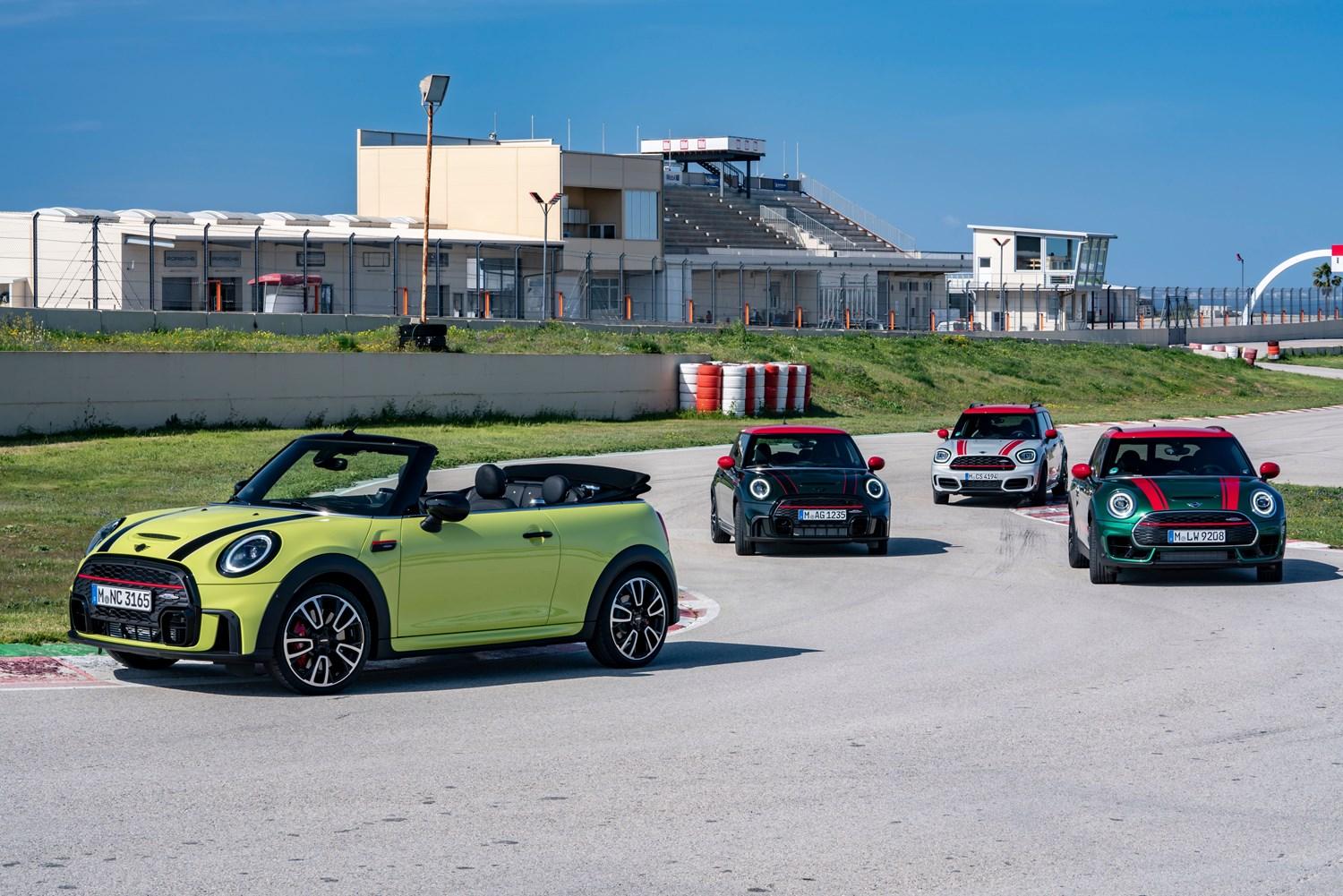 The new MINI John Cooper Works range in different colours, parked around the bend on a racetrack