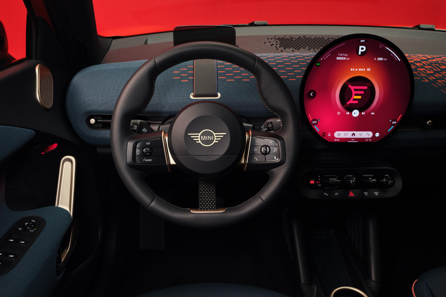 All-Electric Mini Aceman black leather steering wheel and new circular OLED display.