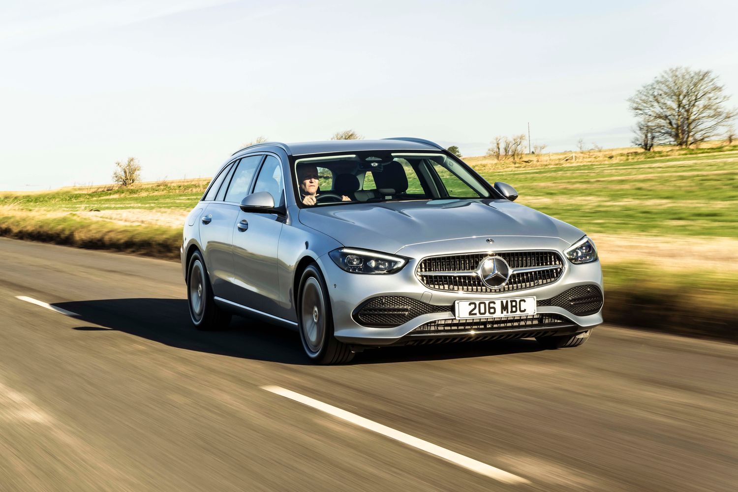Silver C Class Estate driving front view