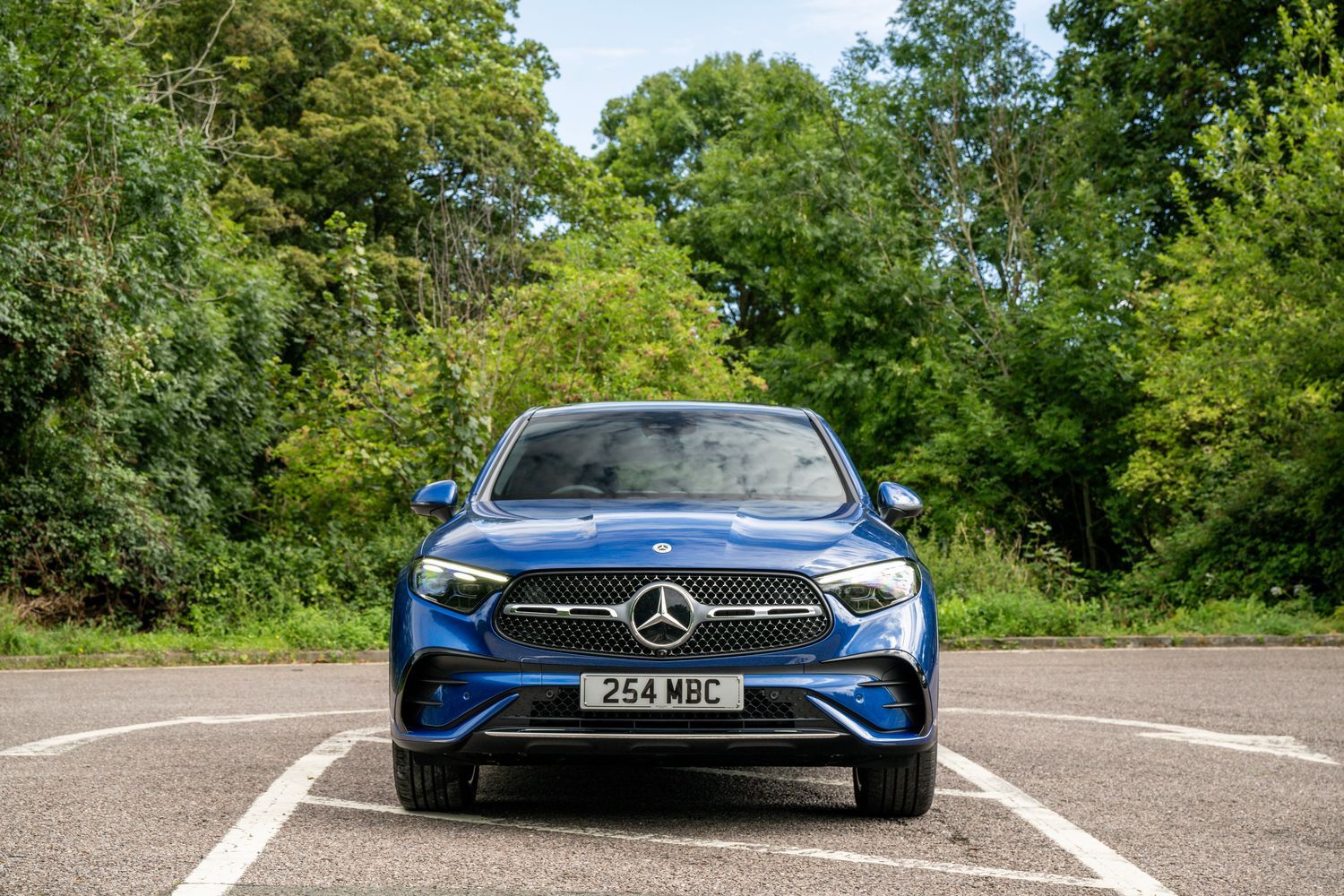 The front view of a blue Mercedes-Benz GLC Coupé.