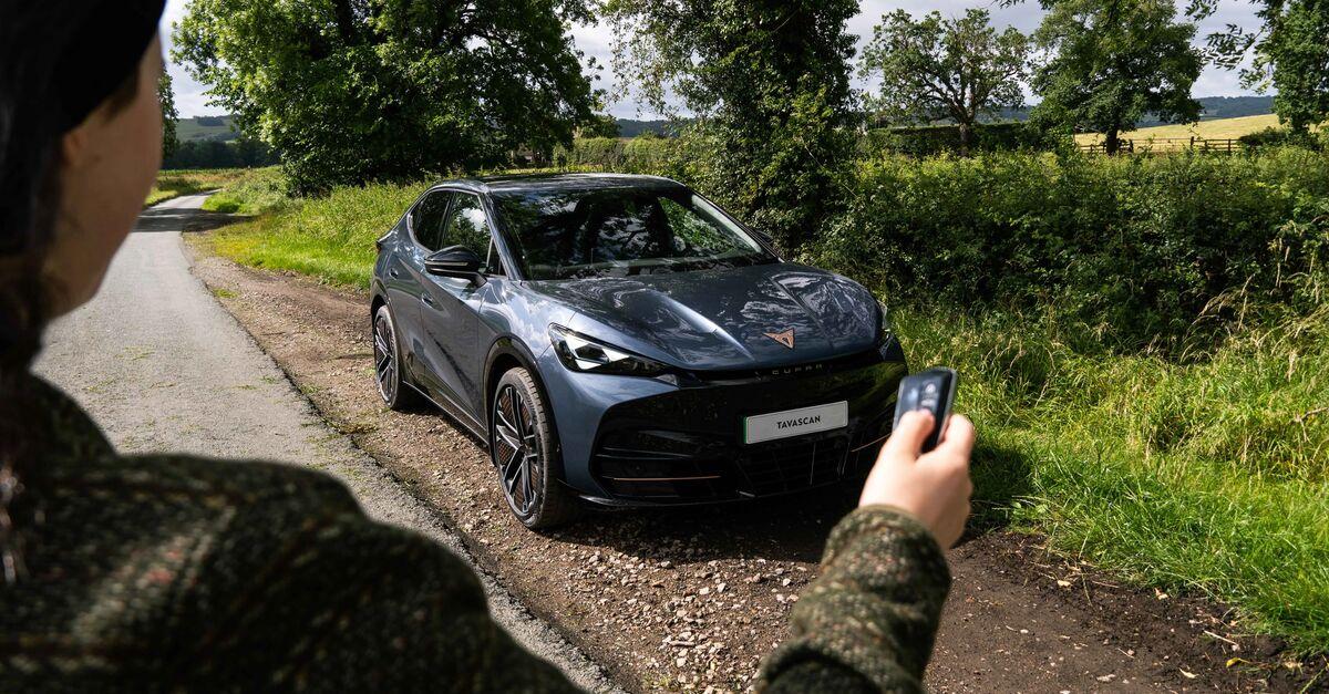 Woman holding key for CUPRA Tavascan