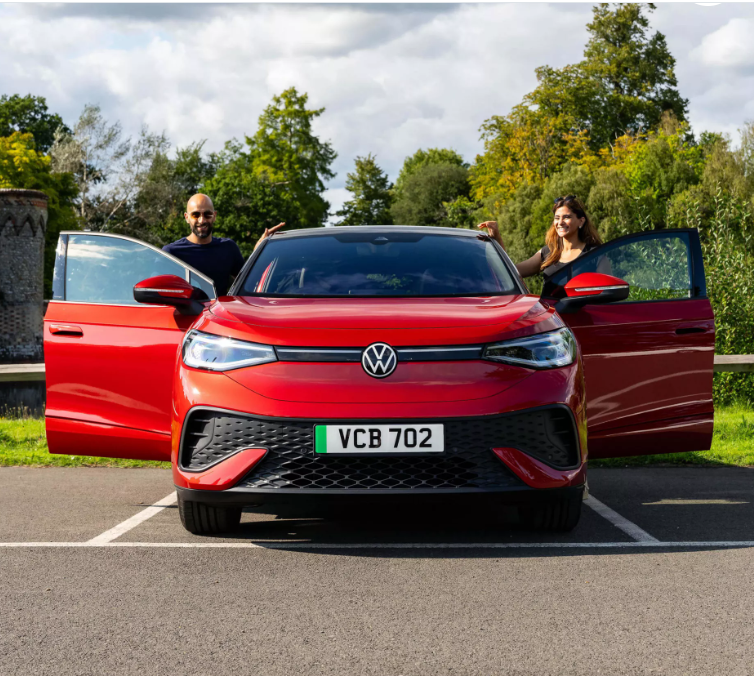 Couple getting into an all electric Volkswagen ID