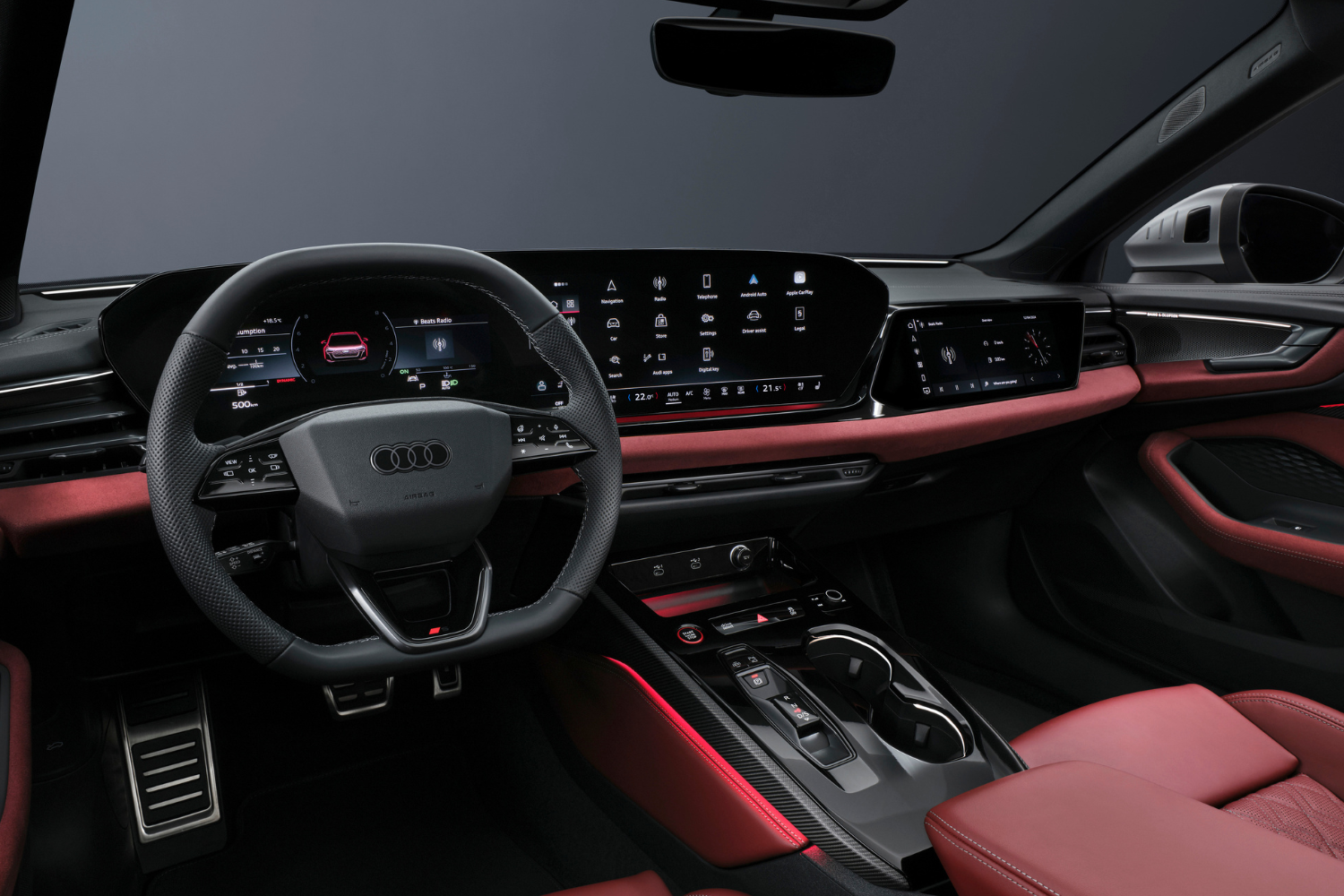 The new Audi S5 Avant's red and black interior with three driver displays.