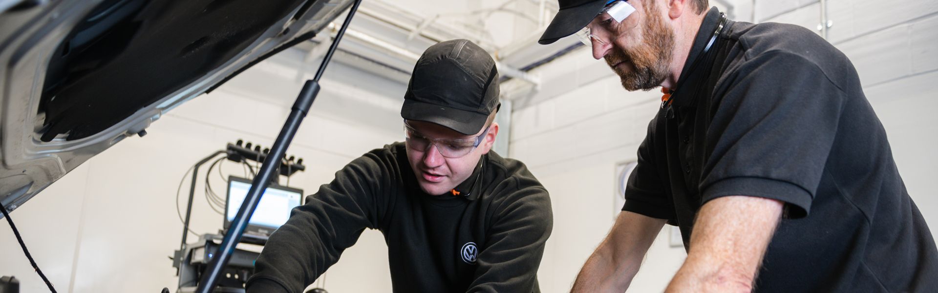 Two Volkswagen Technicians conduct a brake fluid change at Agnew Volkswagen Belfast