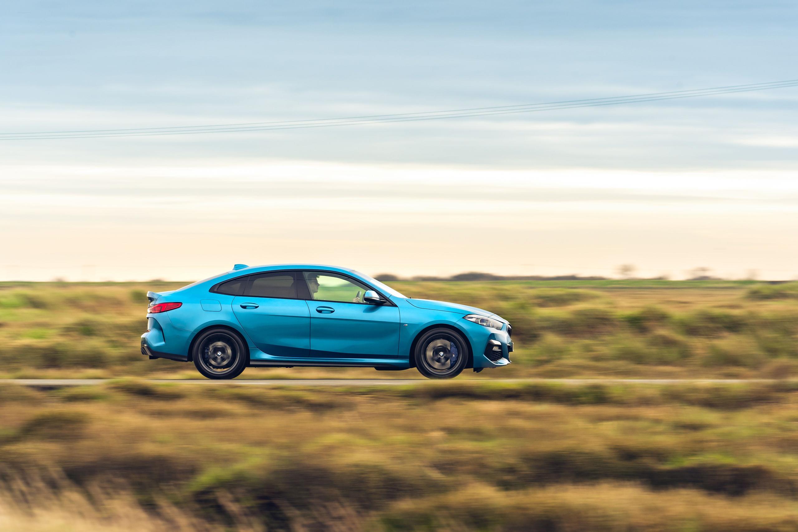 New BMW 2 Series in blue side view image of vehicle driving on a road