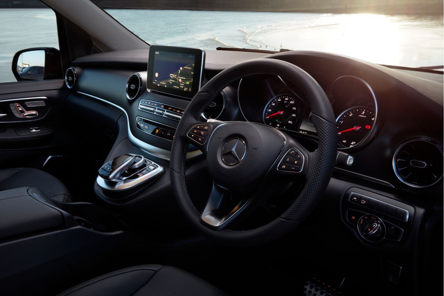 Black steering wheel and driver display inside the interior of a Mercedes-Benz V-Class.